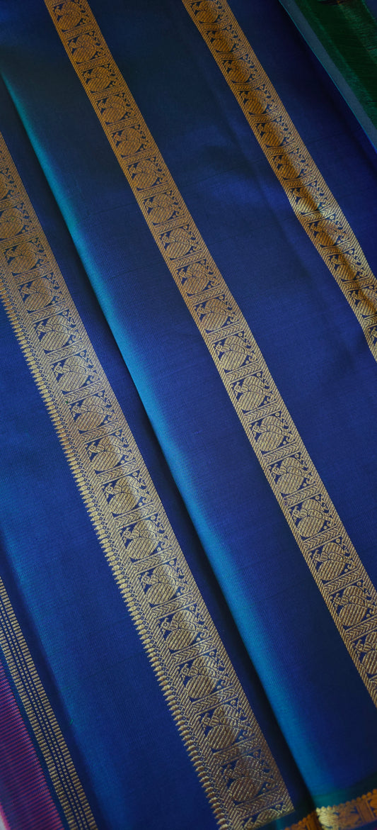 Rust with a shot of pink and peacock Color kanjivaram silk saree