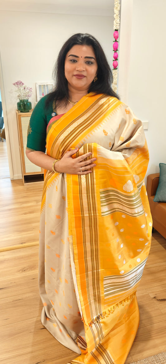 Beige with yellow and orange thread work Handwoven Gadwal Silk Sari