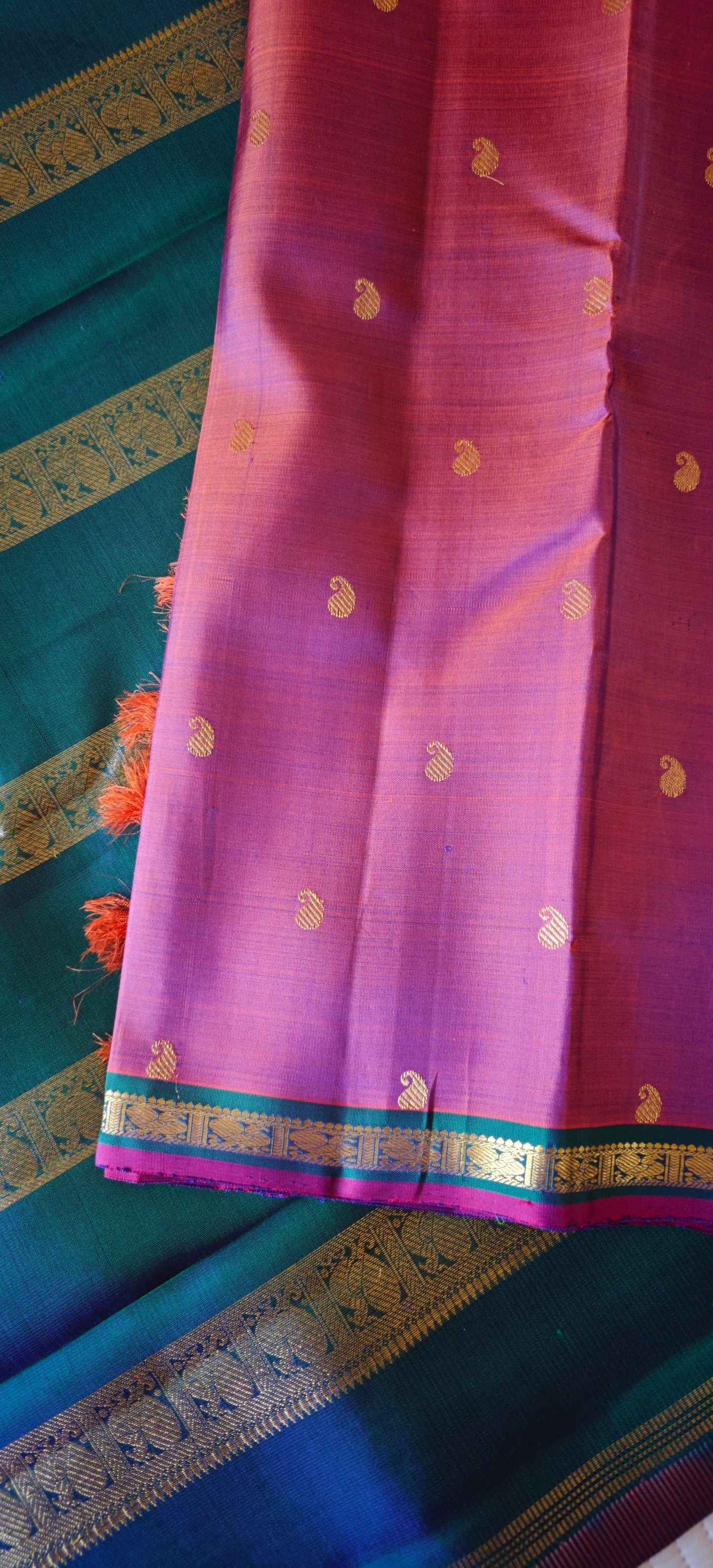 Rust with a shot of pink and peacock Color kanjivaram silk saree
