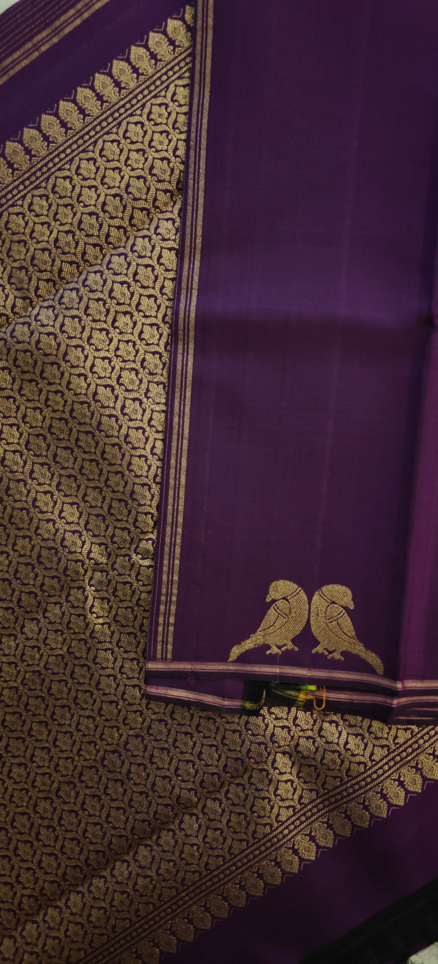 Deep purple Kanjivaram silk saree with parrot motifs