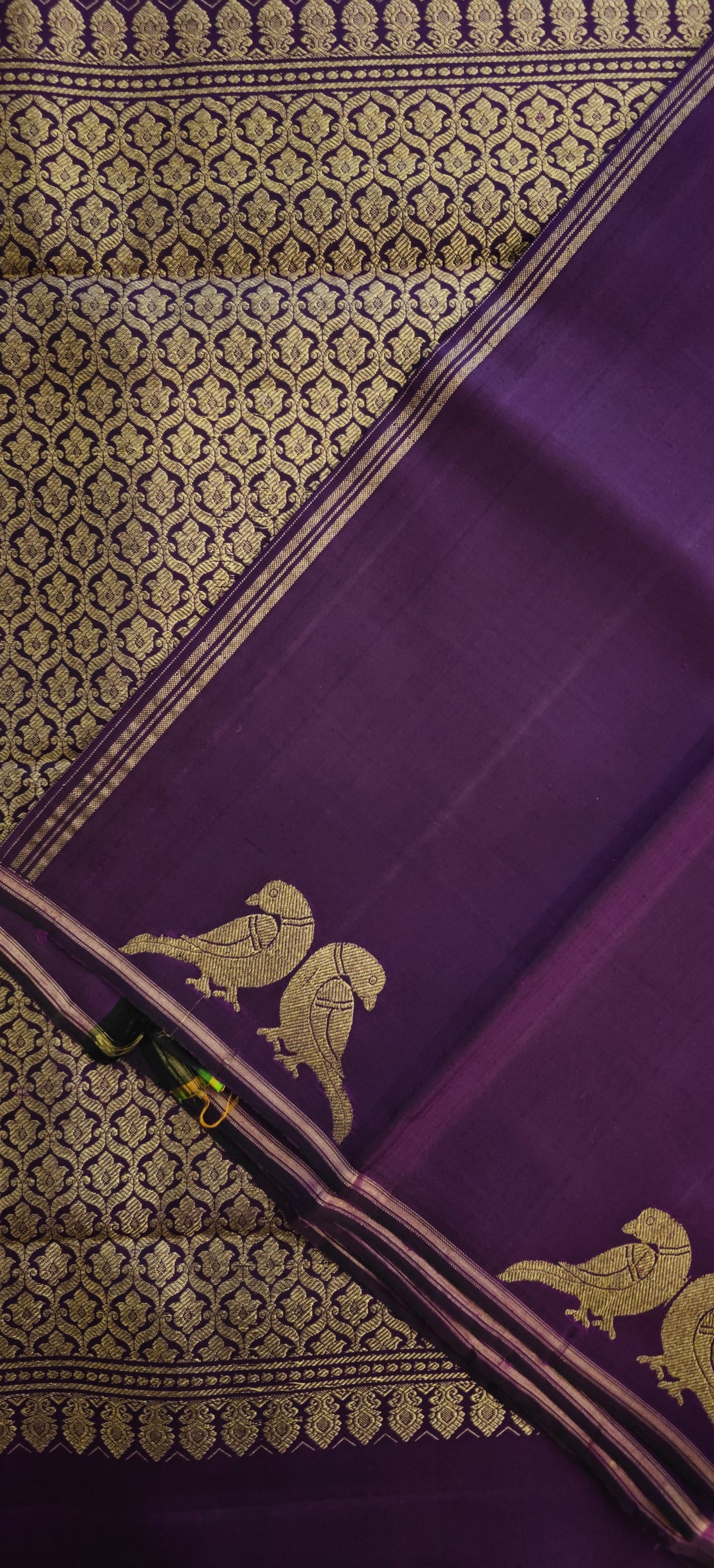 Deep purple Kanjivaram silk saree with parrot motifs