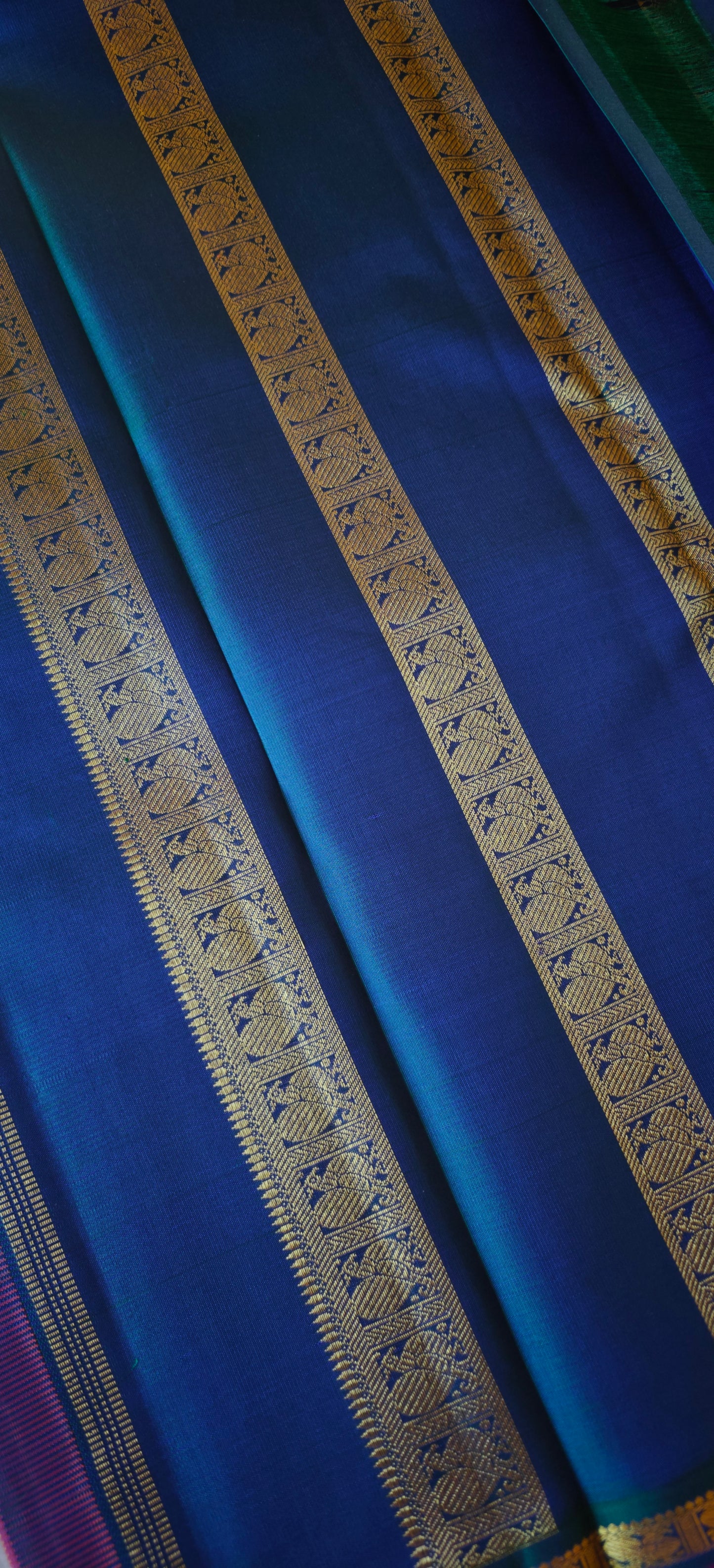 Rust with a shot of pink and peacock Color kanjivaram silk saree