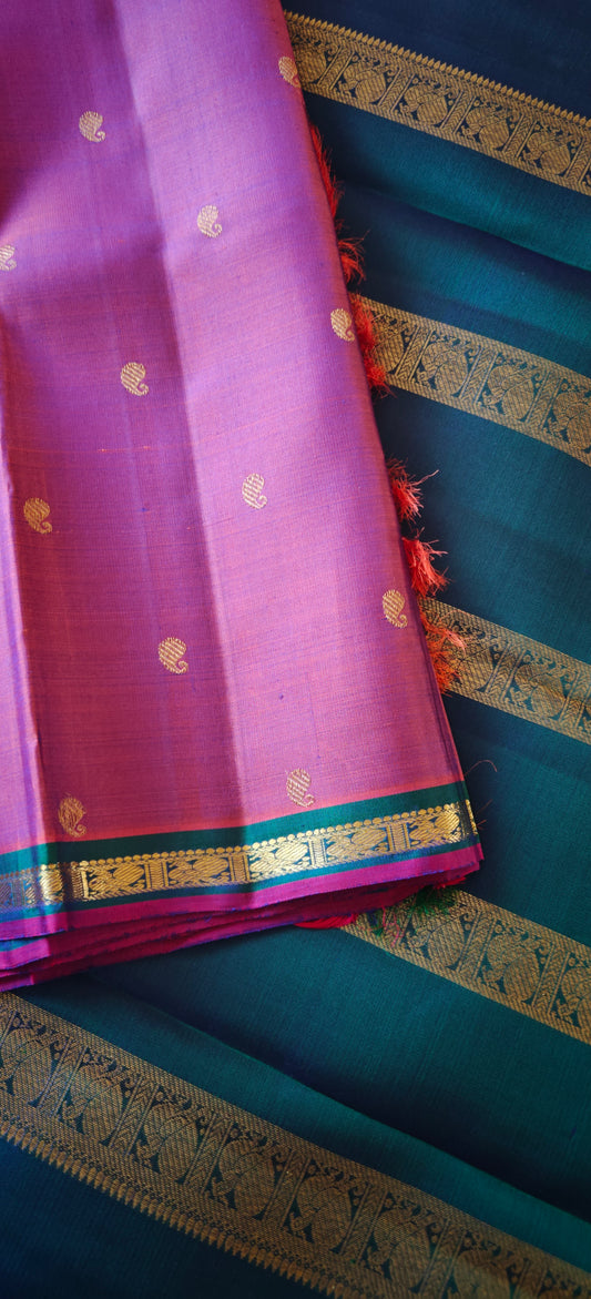 Rust with a shot of pink and peacock Color kanjivaram silk saree