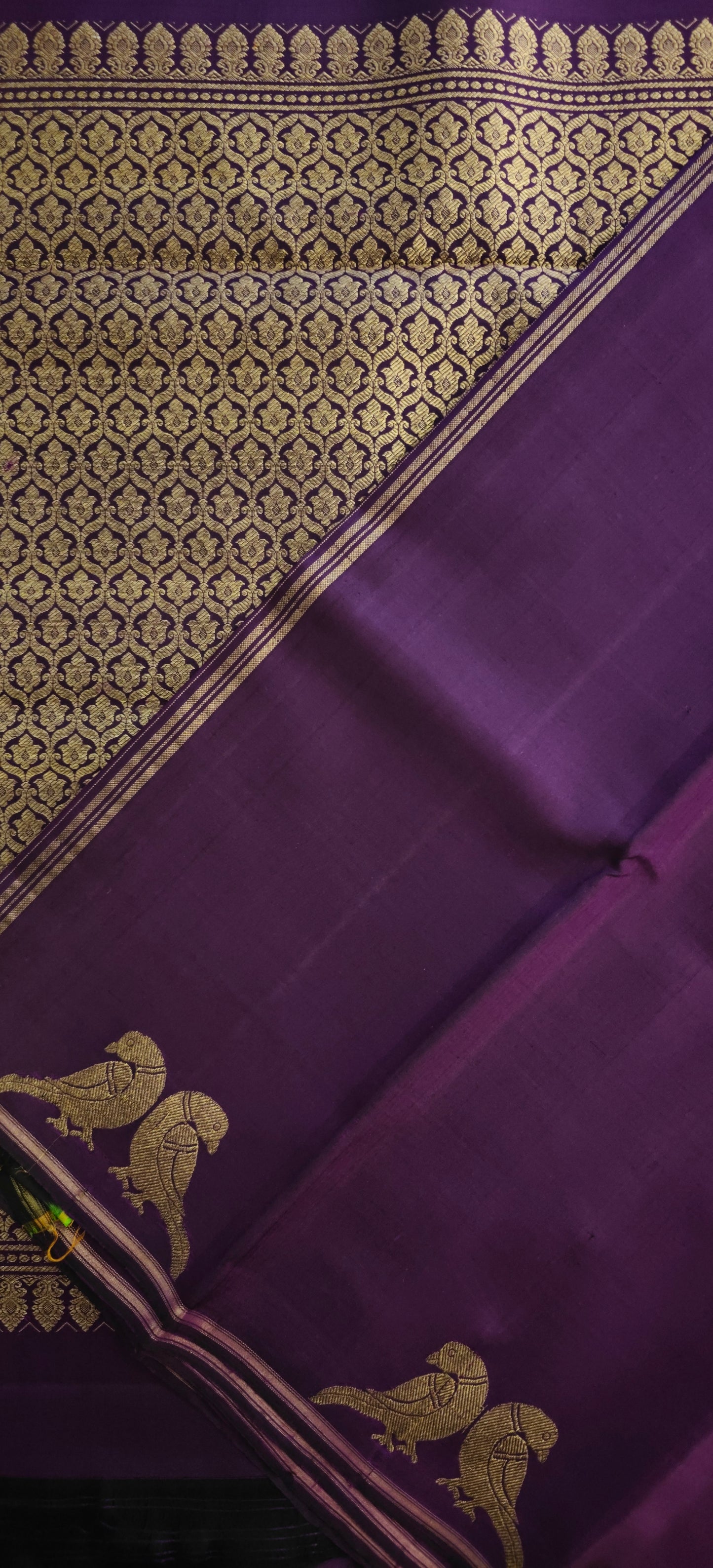 Deep purple Kanjivaram silk saree with parrot motifs