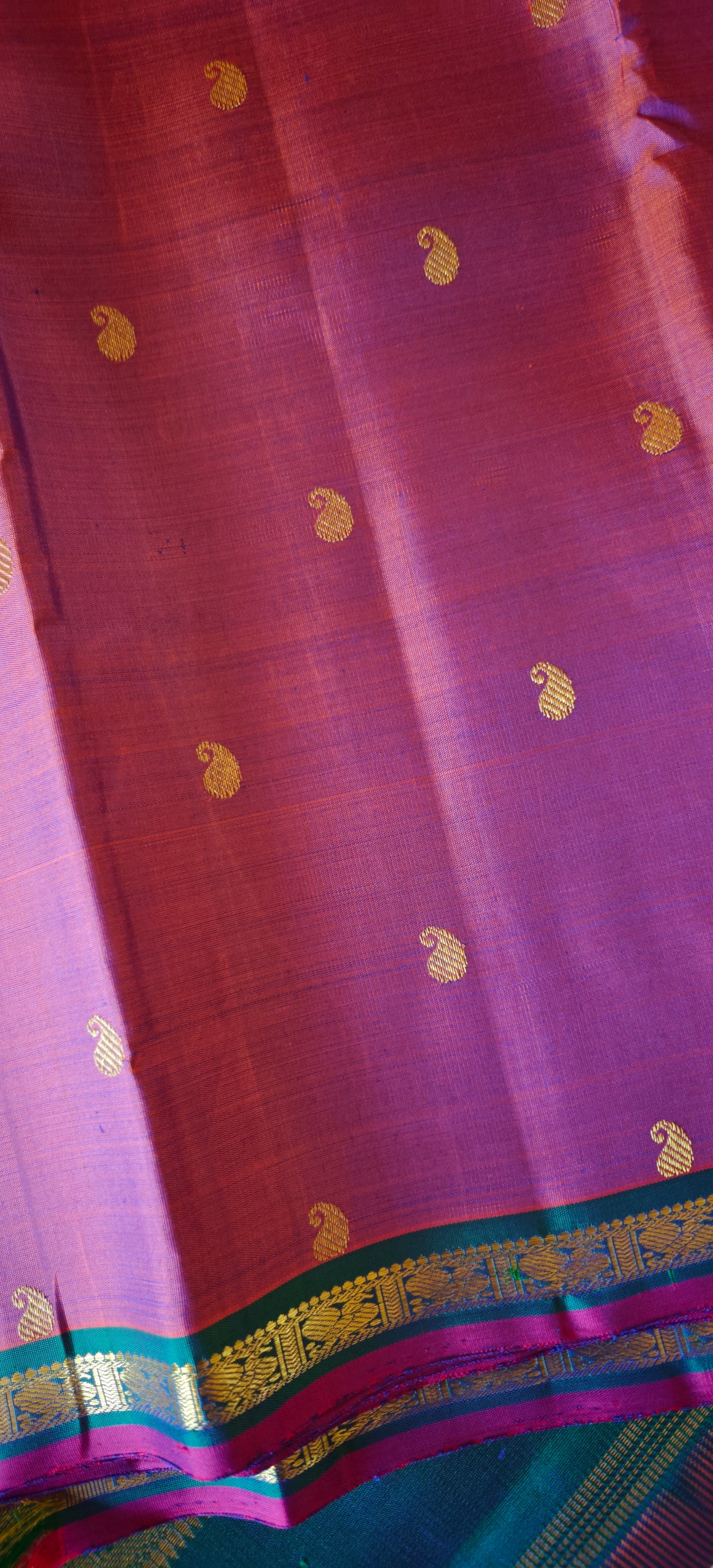 Rust with a shot of pink and peacock Color kanjivaram silk saree