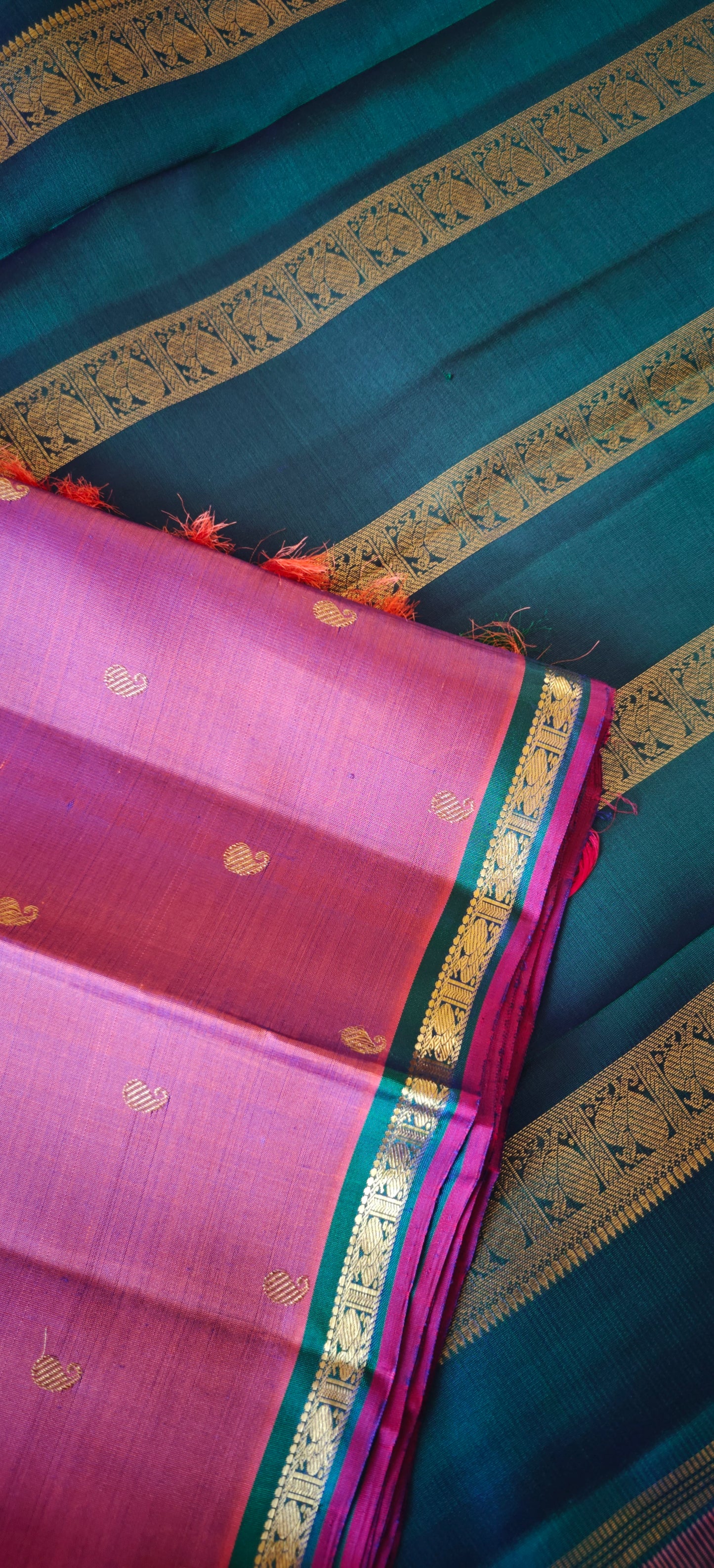 Rust with a shot of pink and peacock Color kanjivaram silk saree