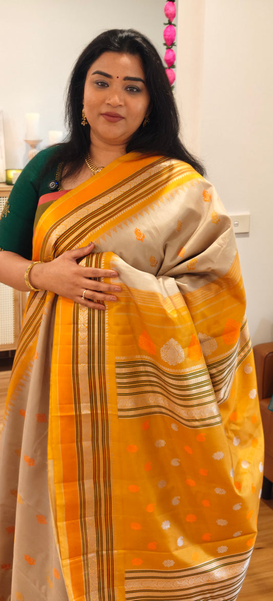 Beige with yellow and orange thread work Handwoven Gadwal Silk Sari