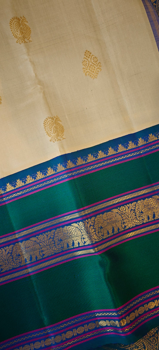 Cream and Peacock blue kanjivaram silk saree